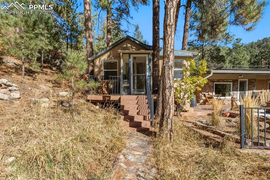1144 Rock Creek Canyon Road, Unit A Colorado Springs, CO 80926 - Photo 32 of 50 front view of house with a yard