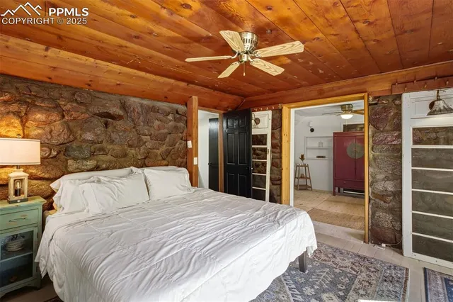 a living room with a couch and a chandelier