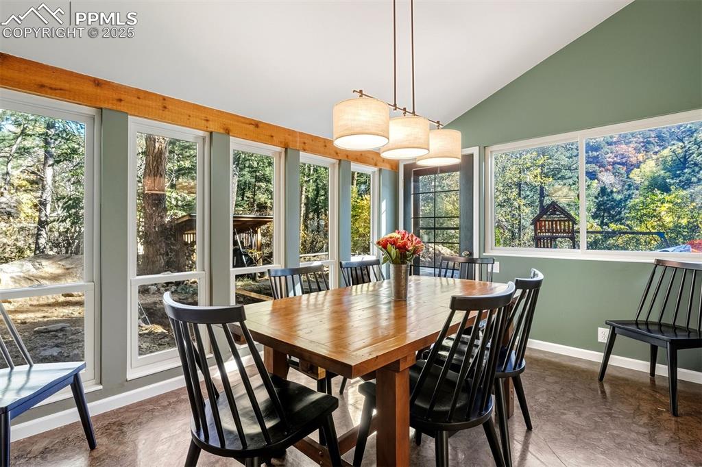 1144 Rock Creek Canyon Road, Unit A Colorado Springs, CO 80926 - Photo 4 of 50 a view of a dining room with furniture window and outside view