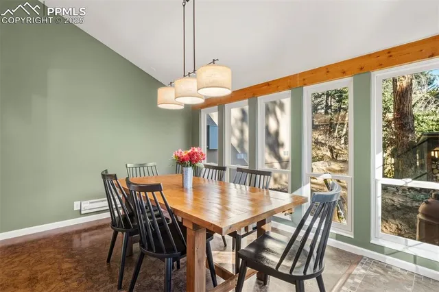 a view of a dining room with furniture window and outside view