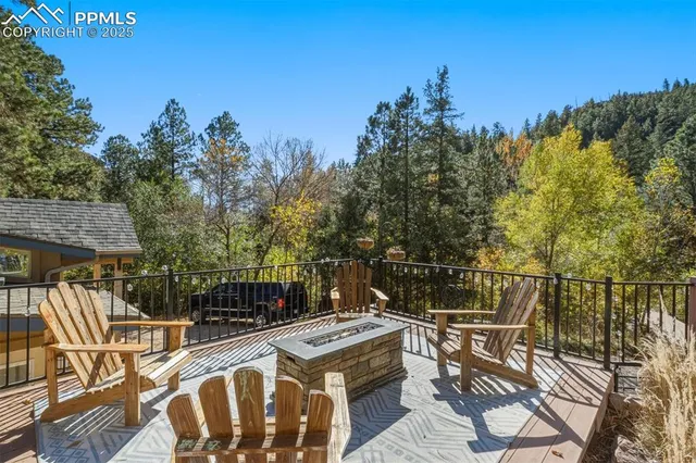 a view of balcony with wooden floor and fence