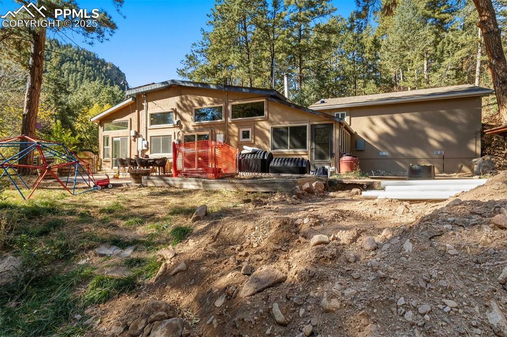 1144 Rock Creek Canyon Road, Unit A Colorado Springs, CO 80926 - Photo 46 of 50 a view of a house with backyard