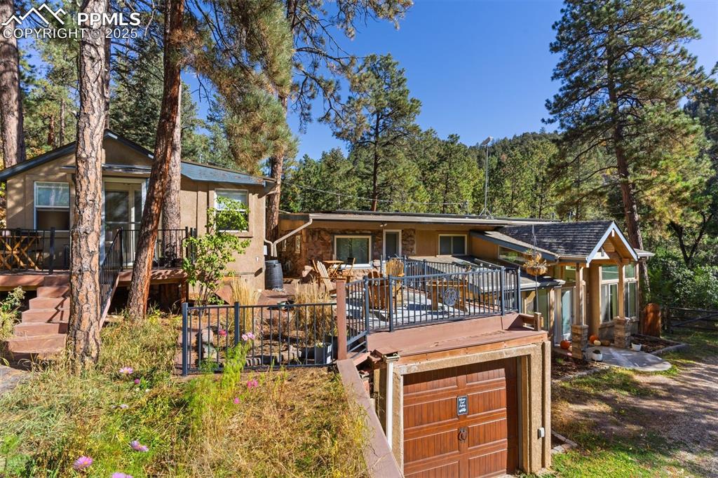 1144 Rock Creek Canyon Road, Unit A Colorado Springs, CO 80926 - Photo 50 of 50 a front view of a house with a yard