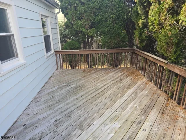 a view of deck with wooden floor and fence