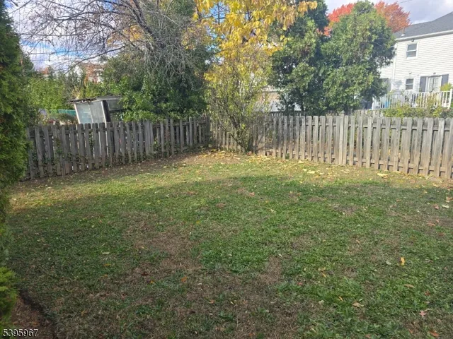 a garden with wooden fence