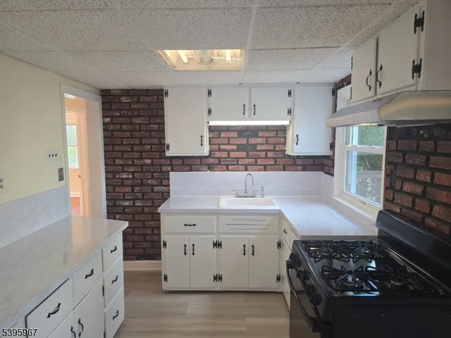 a kitchen with a stove and cabinets