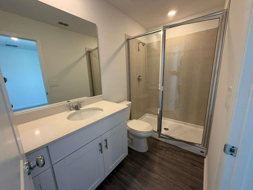 7194 Southwest 91st Lane Ocala, FL 34476 - Photo 11 of 20 a bathroom with a double vanity sink toilet and shower