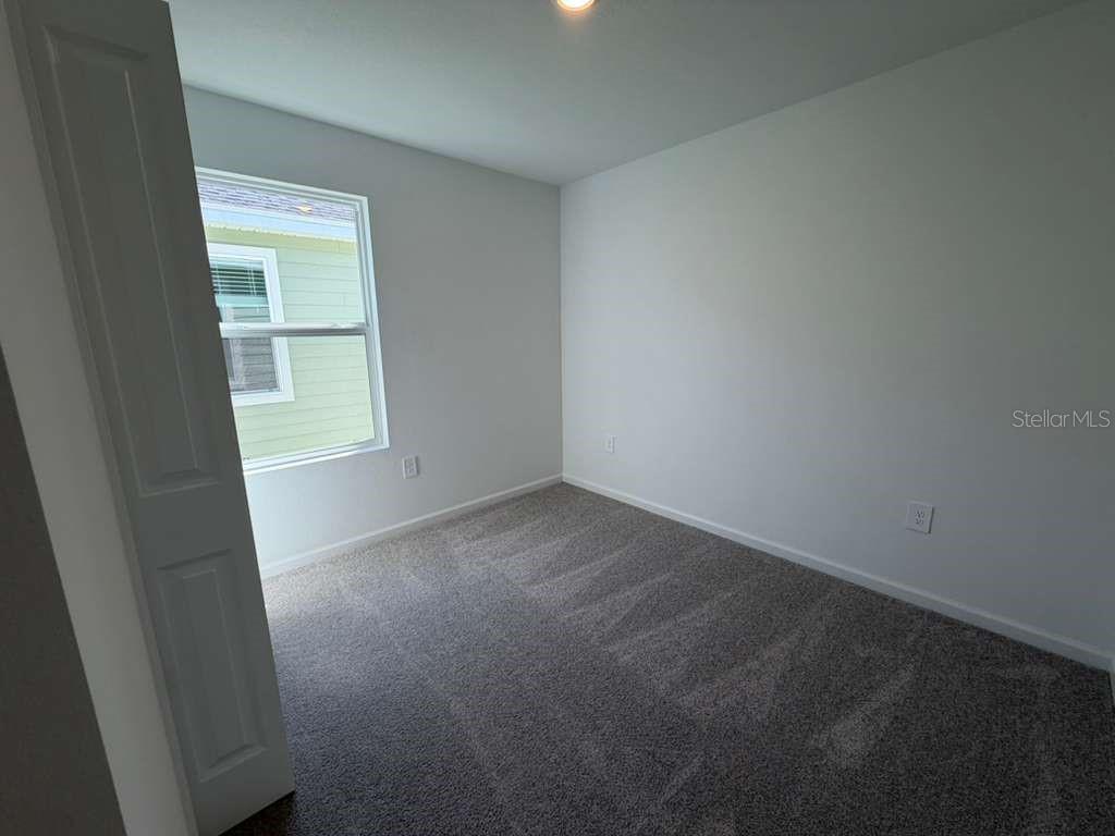 7194 Southwest 91st Lane Ocala, FL 34476 - Photo 12 of 20 an empty room with a window