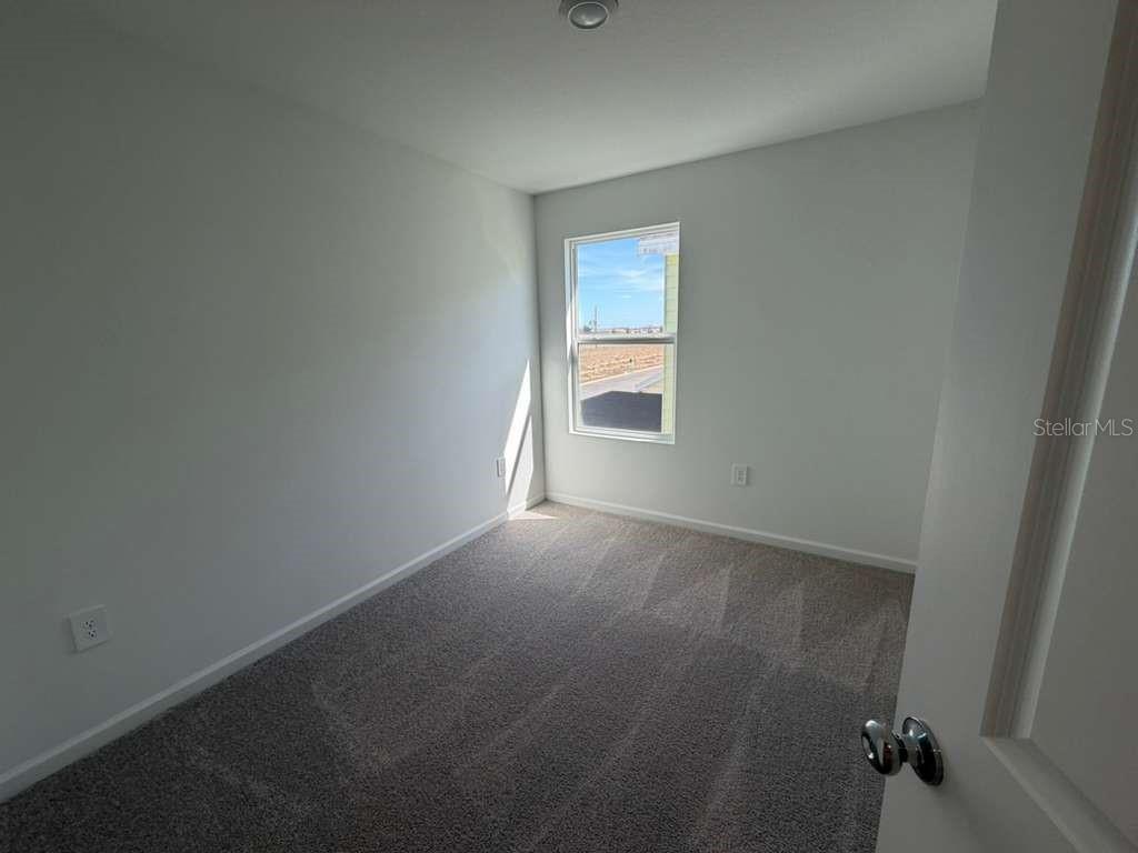 7194 Southwest 91st Lane Ocala, FL 34476 - Photo 5 of 20 an empty room with windows