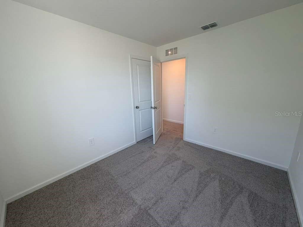 7194 Southwest 91st Lane Ocala, FL 34476 - Photo 10 of 20 a view of an empty room and closet area