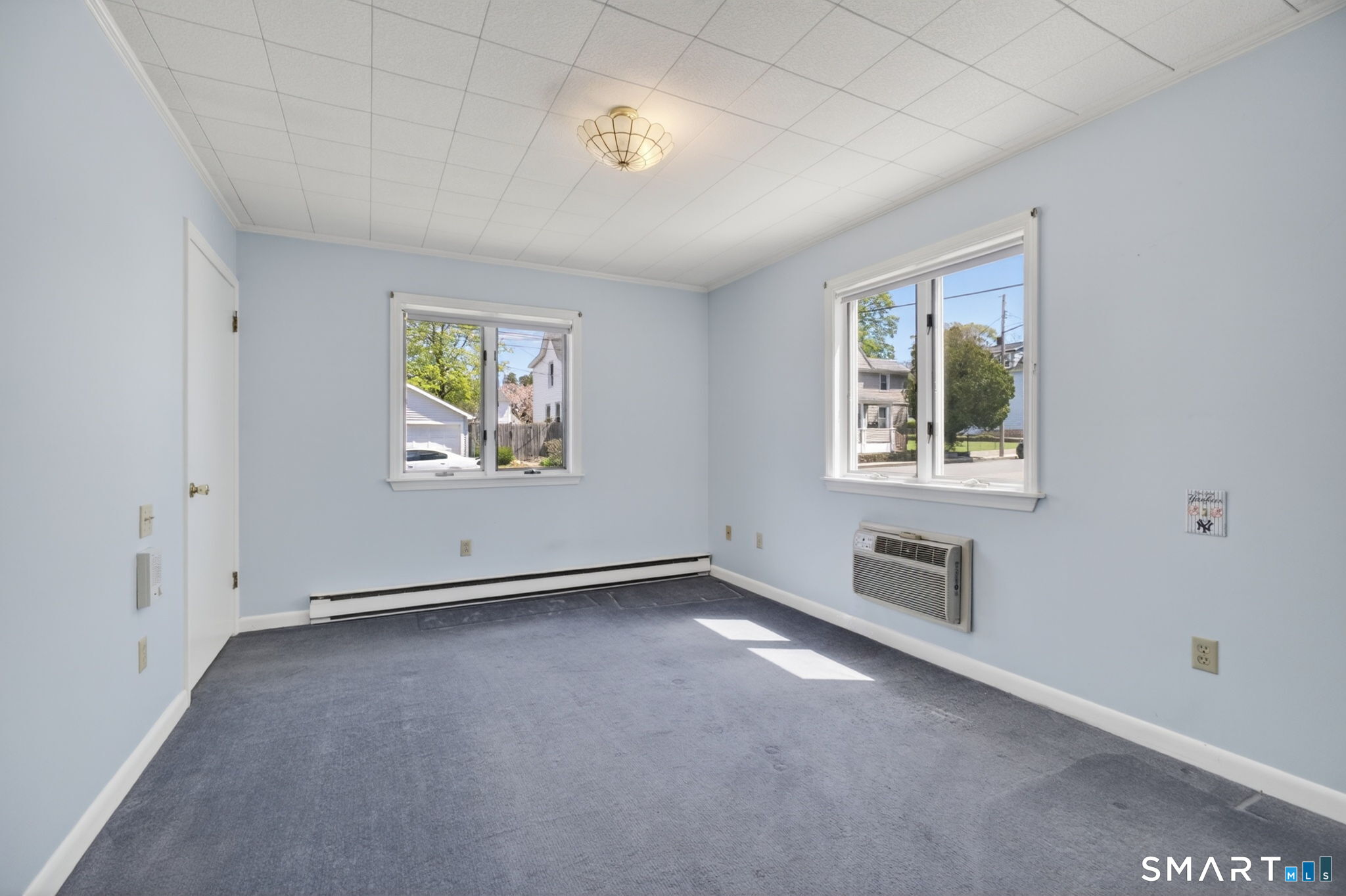 19 High Street Groton, CT 06340 - Photo 18 of 38 an empty room with windows and ceiling fan