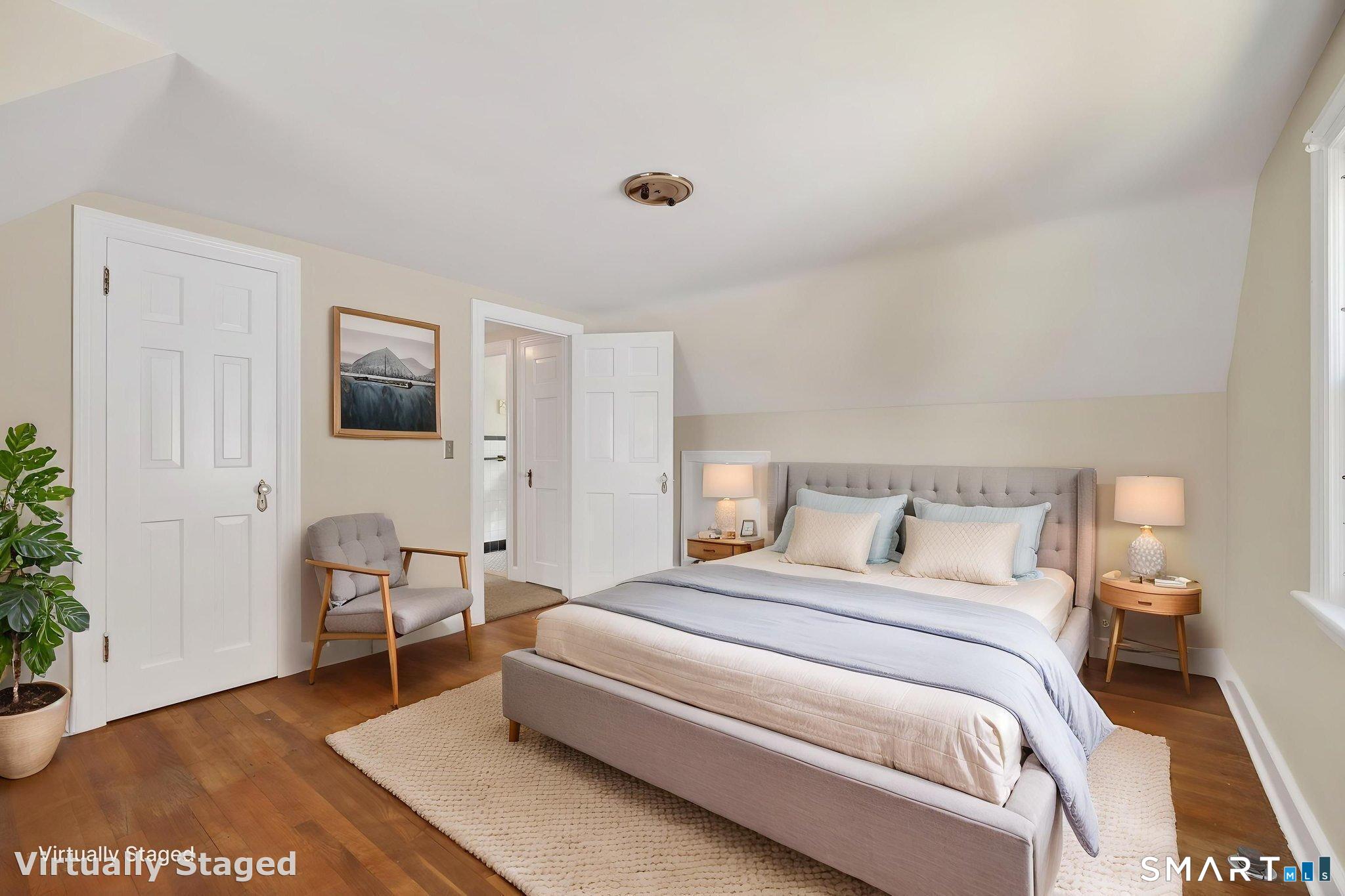 19 High Street Groton, CT 06340 - Photo 21 of 38 a bedroom with a bed and a chair