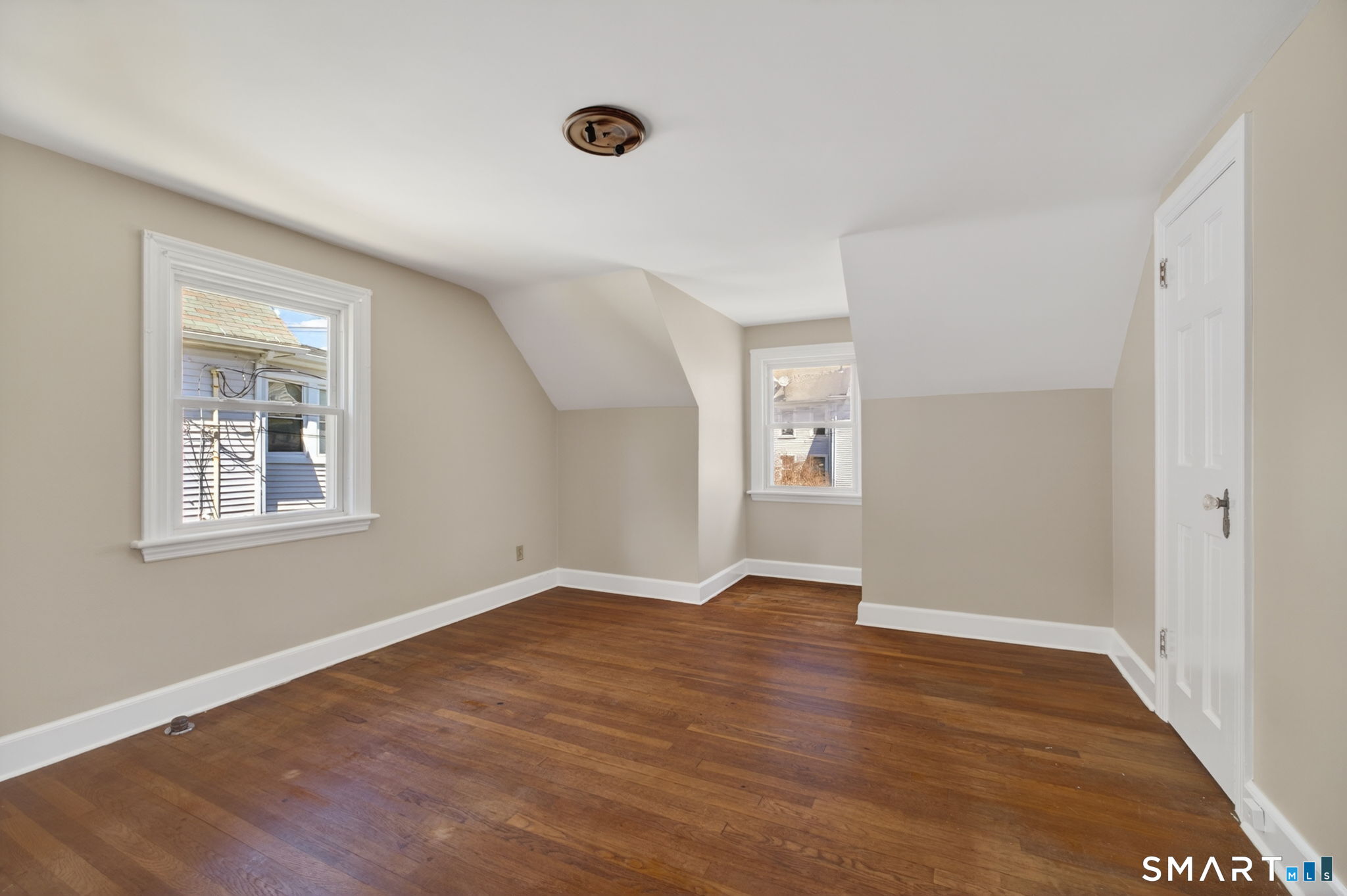 19 High Street Groton, CT 06340 - Photo 23 of 38 a view of an empty room with wooden floor and a window