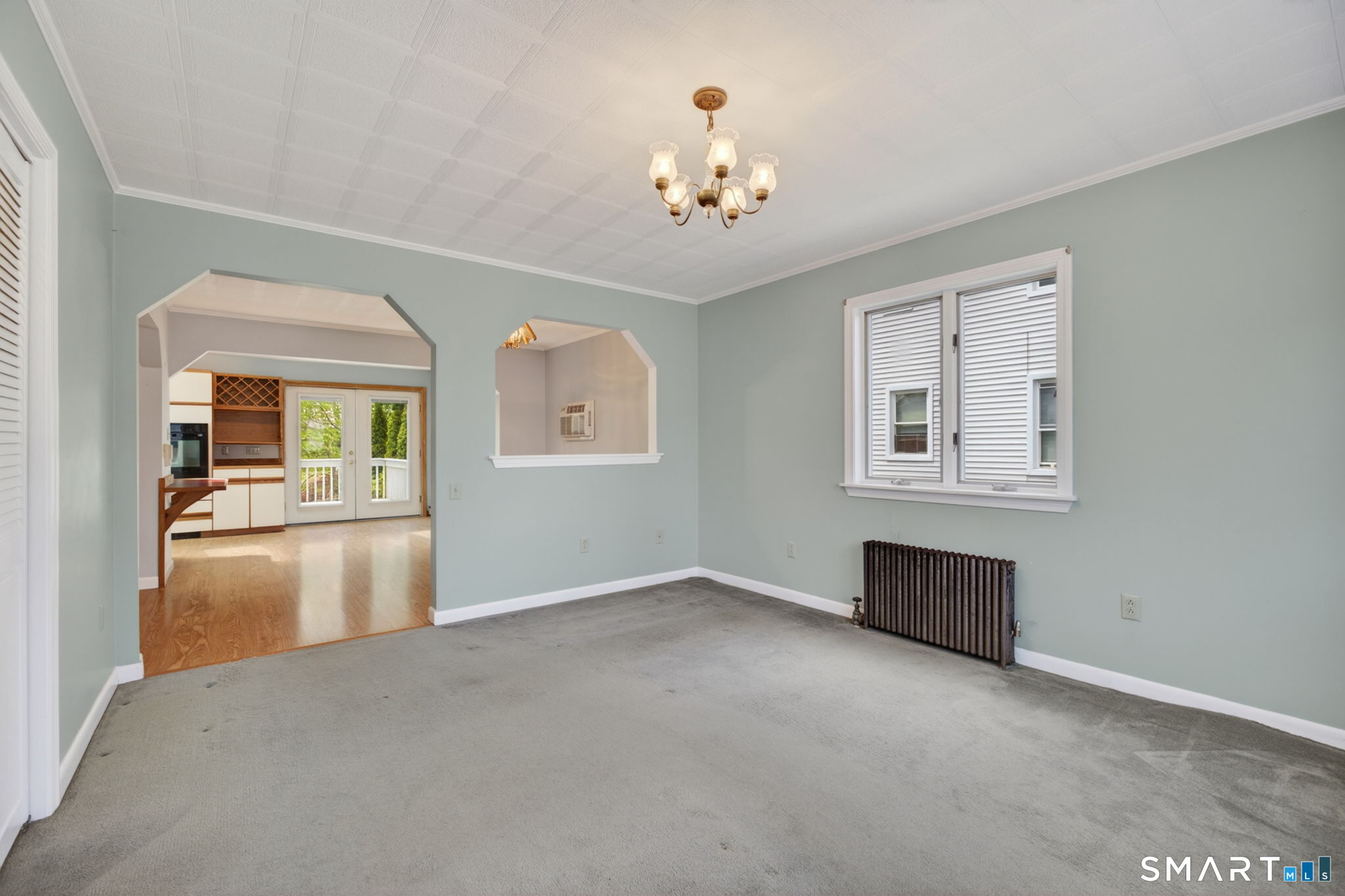 19 High Street Groton, CT 06340 - Photo 4 of 38 an empty room with chandelier and windows