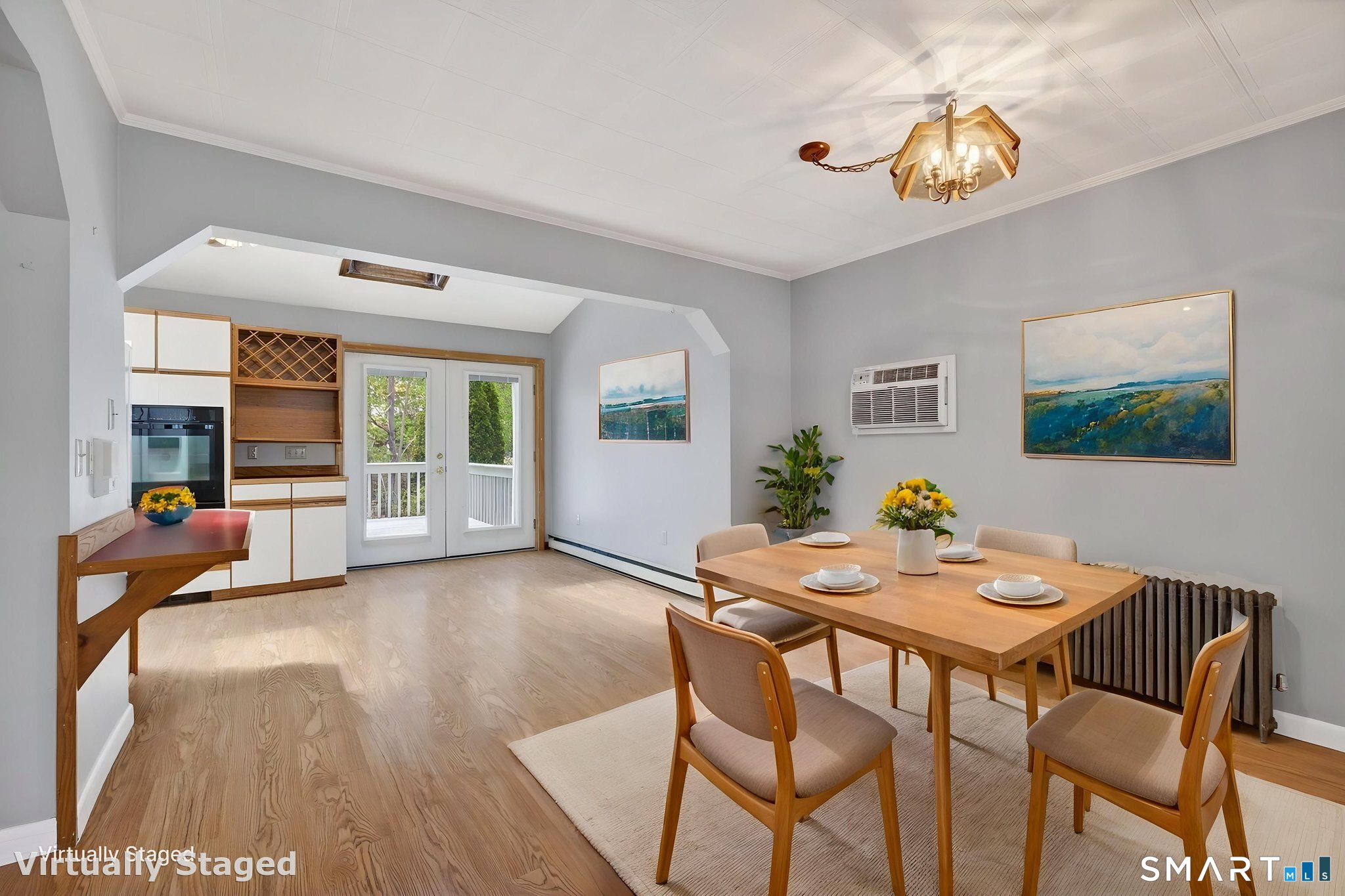 19 High Street Groton, CT 06340 - Photo 9 of 38 a view of a dining room with furniture and a potted plant