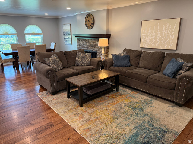 362 East 9150th Street South Sandy, UT 84070 - Photo 2 of 41 Living area featuring hardwood / wood-style floors, recessed lighting, a stone fireplace, and ornamental molding