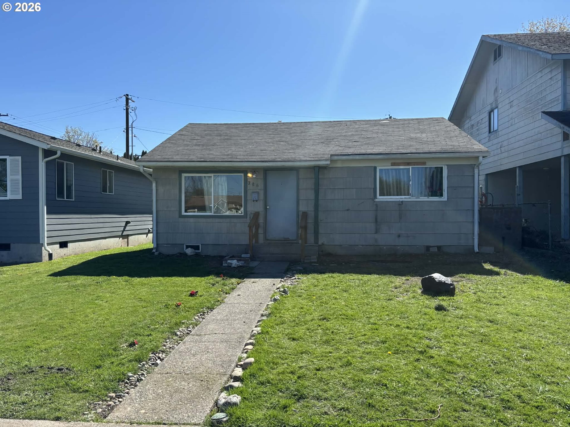 a front view of a house with garden