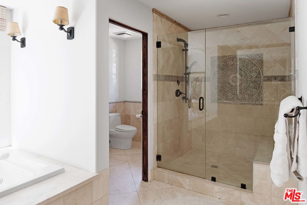 2251 Cold Canyon Road Calabasas, CA 91302 - Photo 19 of 47 a bathroom with a shower and a toilet