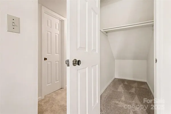 a view of a small space with wooden floor