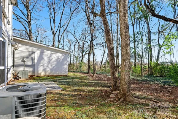 a backyard of apartments with large trees