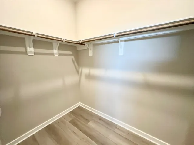 a bathroom with a shower sink and mirror