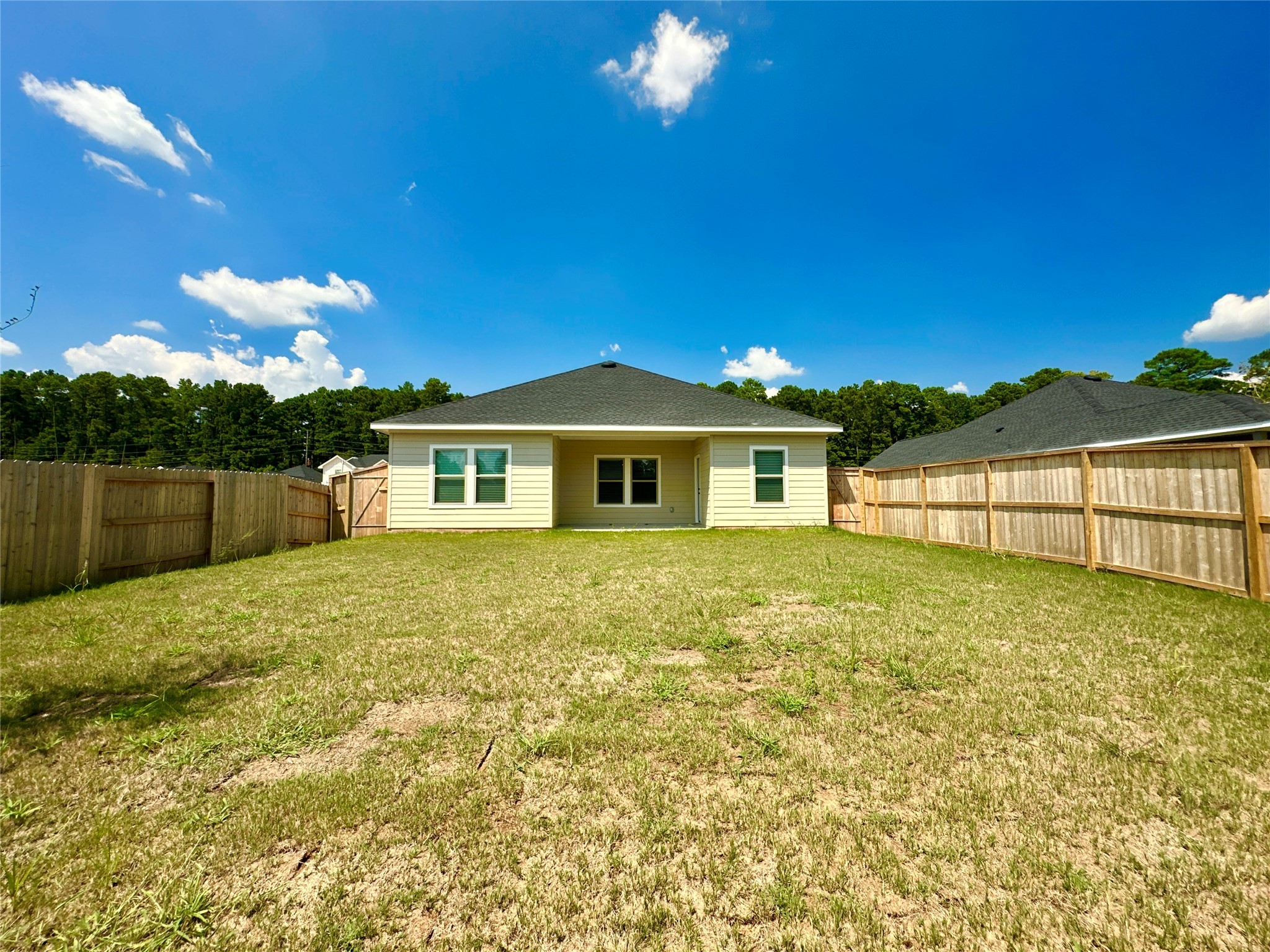 12324 Ridge Top Drive Conroe, TX 77304 - Photo 15 of 25 a view of a house with backyard and garden