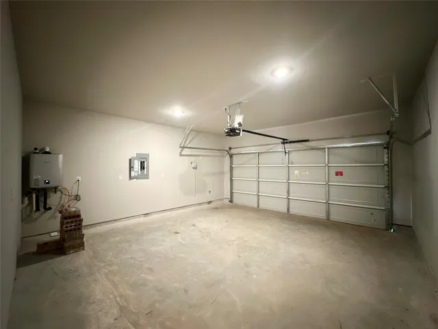 an aerial view of a house with a garden and swimming pool