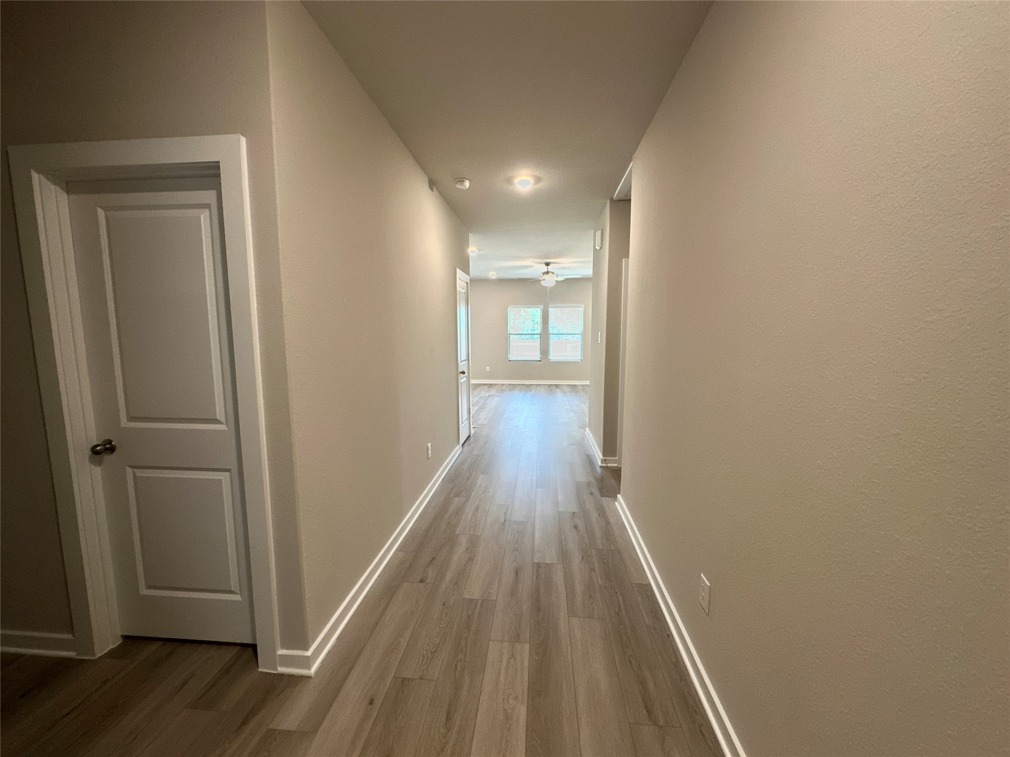 12324 Ridge Top Drive Conroe, TX 77304 - Photo 3 of 25 a view of a hallway with wooden floor