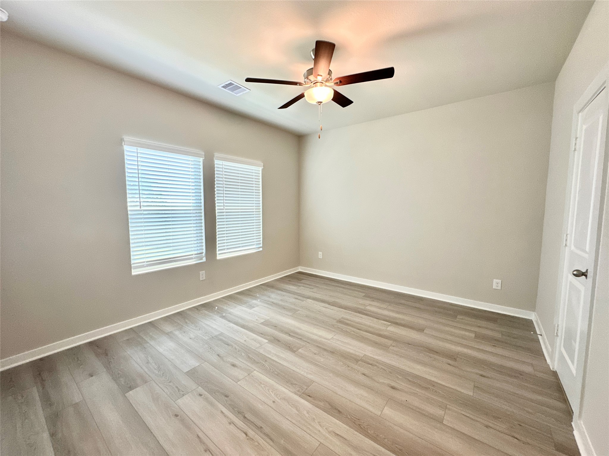 12324 Ridge Top Drive Conroe, TX 77304 - Photo 9 of 25 a view of an empty room with wooden floor and a window