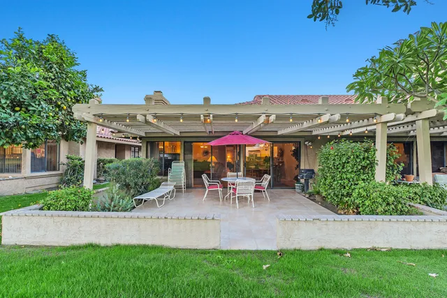 an outdoor view of a house with a yard