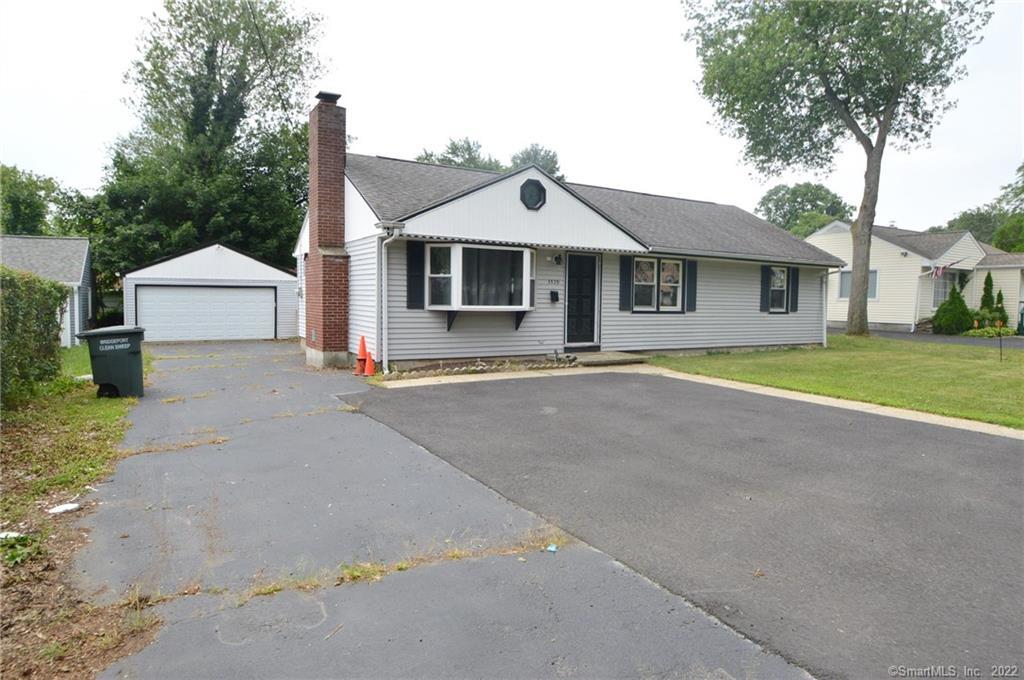 3529 Old Town Road Bridgeport, CT 06606 - Photo 1 of 1 a front view of a house with a yard and garage
