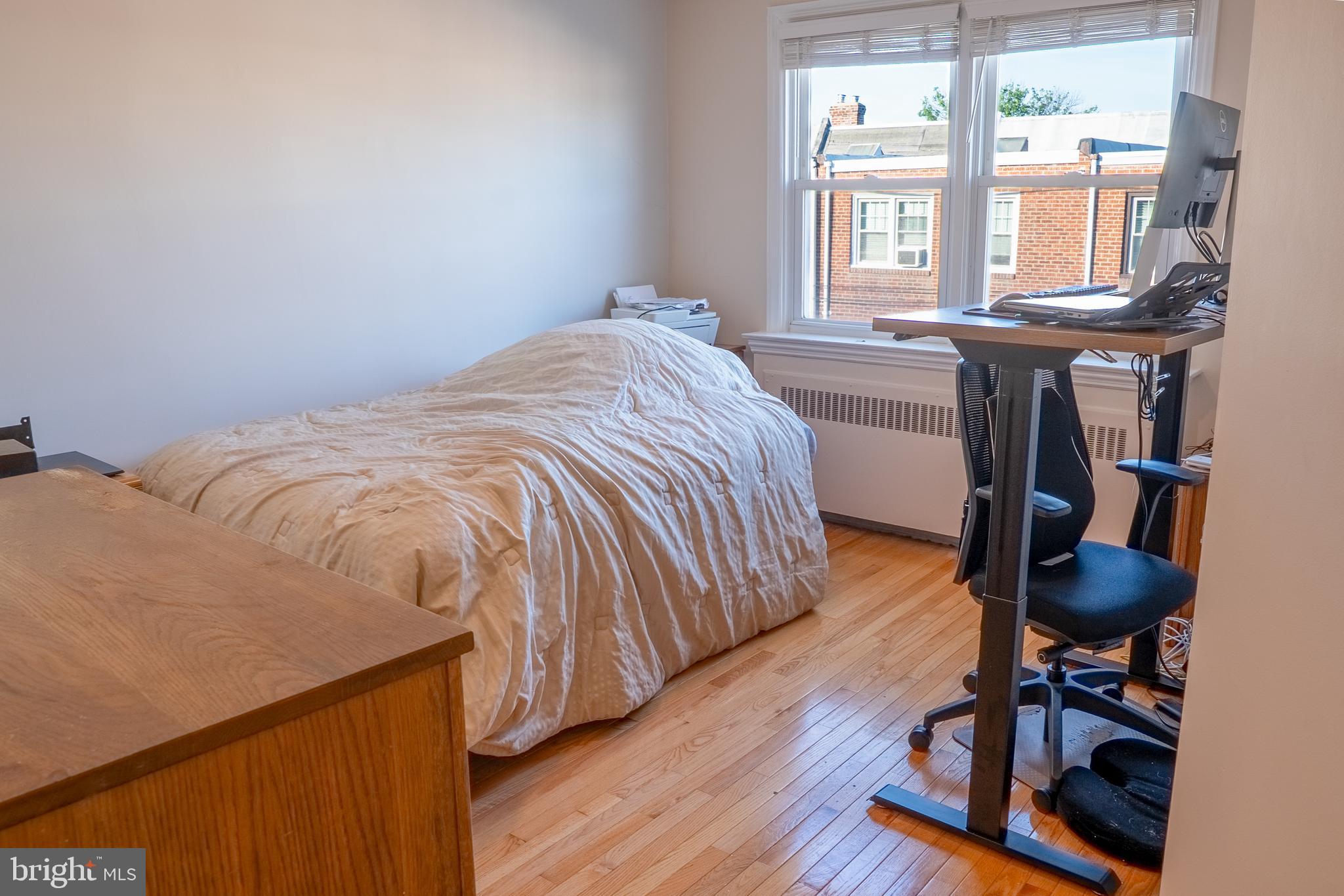 739 Fairfax Road Drexel Hill, PA 19026 - Photo 10 of 18 a bed sitting in a bedroom next to a window