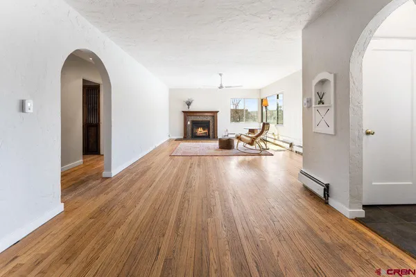 a living room with furniture and a fireplace