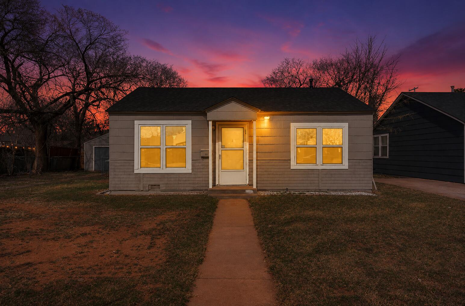 2814 40th Street Lubbock, TX 79413 - Photo 1 of 11 a front view of a house with a yard