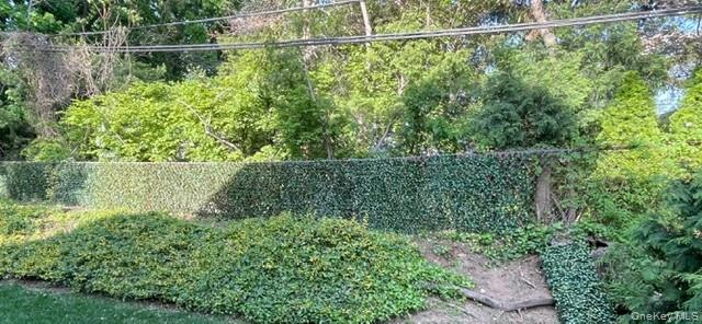 145 Shore Road Manhasset, NY 11030 - Photo 11 of 23 a view of a lake from a balcony