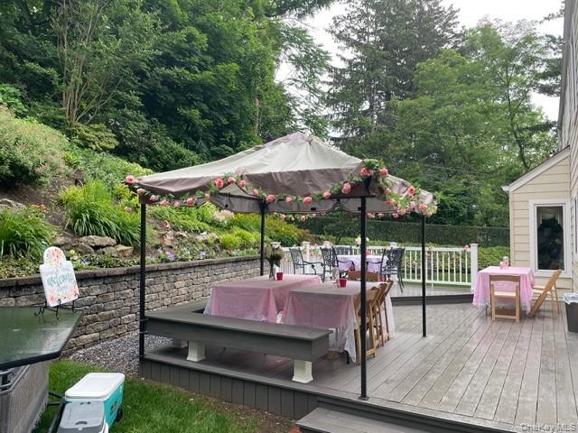 145 Shore Road Manhasset, NY 11030 - Photo 16 of 23 an outdoor sitting area with furniture and wooden deck