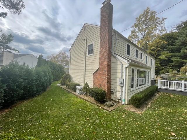 145 Shore Road Manhasset, NY 11030 - Photo 4 of 23 a front view of a house with garden