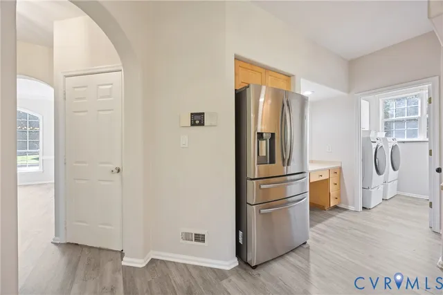 a kitchen with a refrigerator freezer and a dishwasher
