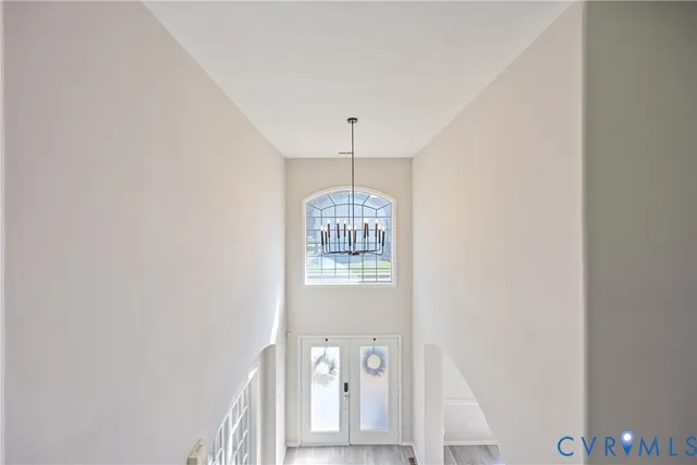 a view of a hallway with windows