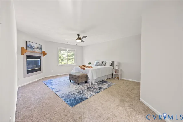 a bed room with a bed and a chandelier