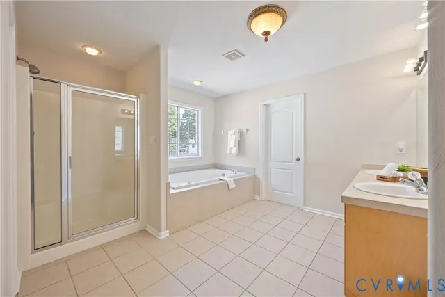 a bathroom with a sink a toilet and a shower