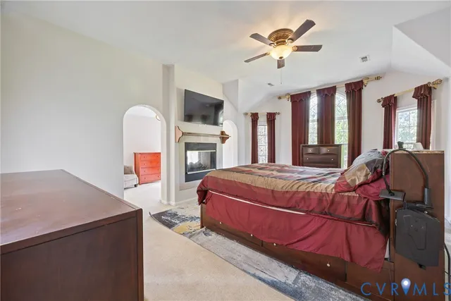 a bed room with a bed and a television