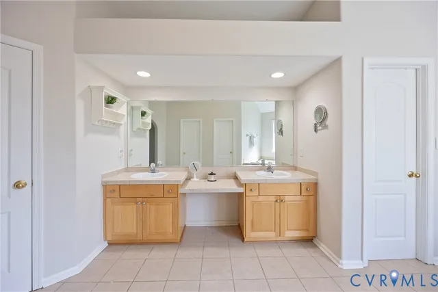 a room with a sink and cabinets