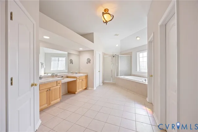 a large kitchen with a sink and dishwasher stove