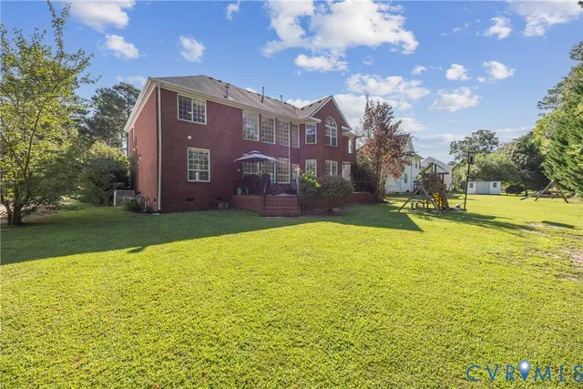 a view of a building with a yard