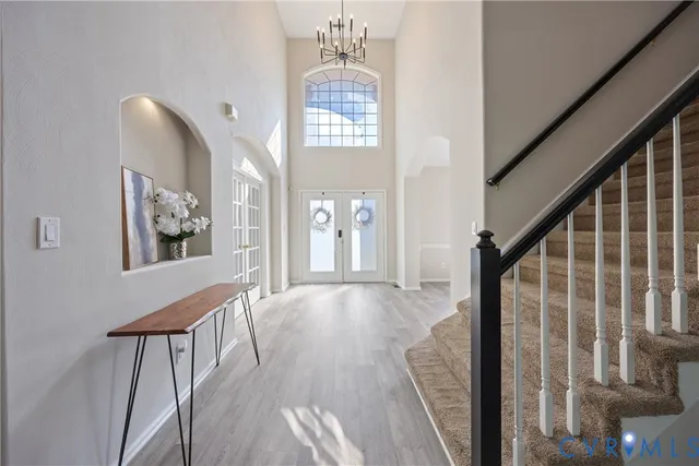 a view of an entryway with wooden floor