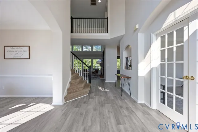 a view of entryway with livingroom and wooden floor