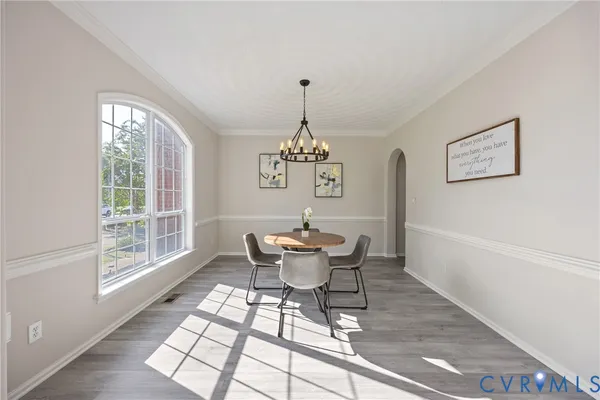 a dining room with furniture window and outside view