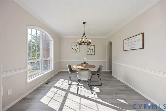 a dining room with furniture window and outside view