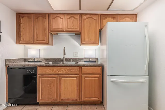 an empty room with a window and a ceiling fan
